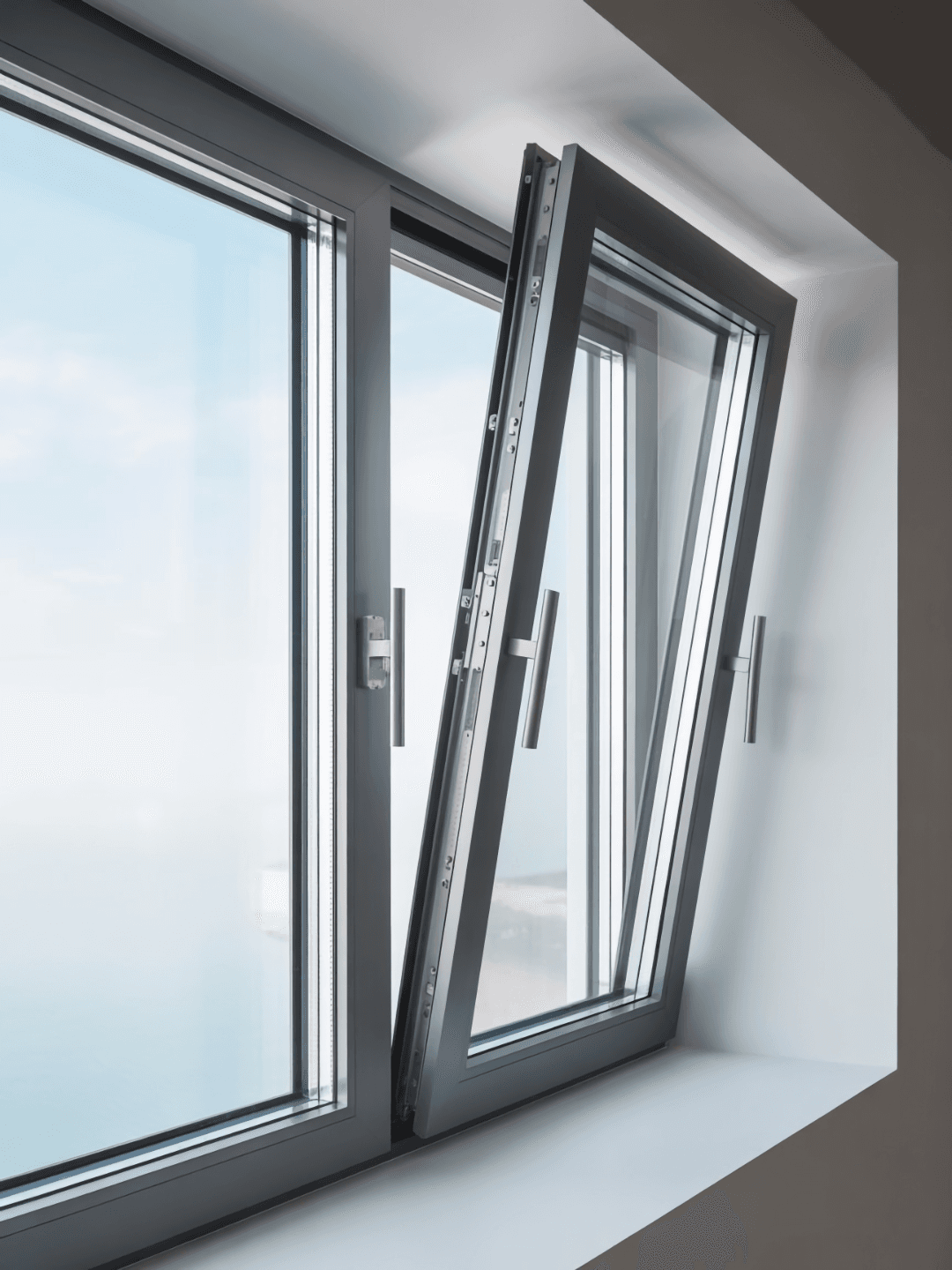 Modern gray aluminum casement window partially open inward with double glazing.